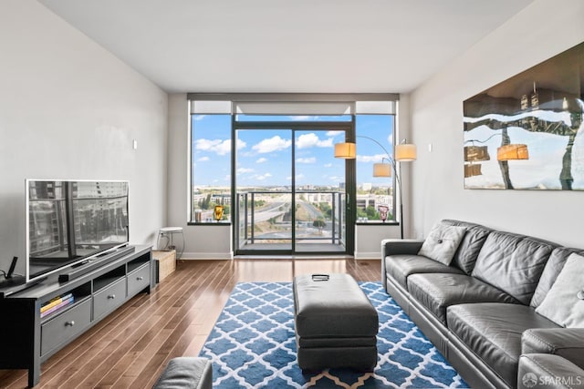 38 N Almaden Blvd Unit 1419, San Jose, CA 95110 - living area with wood finished floors, healthy amount of natural light, baseboards, and a wall of windows