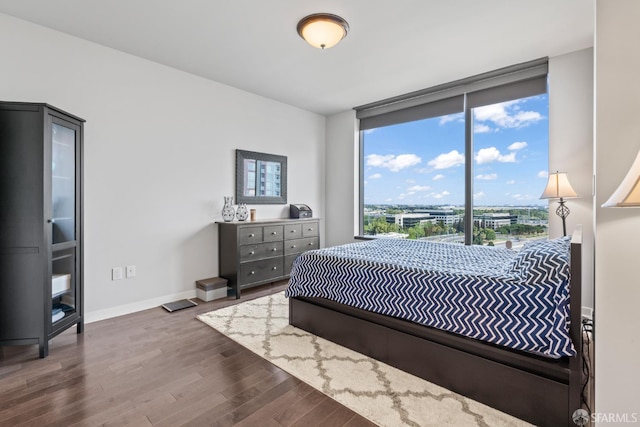 38 N Almaden Blvd Unit 1419, San Jose, CA 95110 - bedroom with wood finished floors, baseboards, and a wall of windows