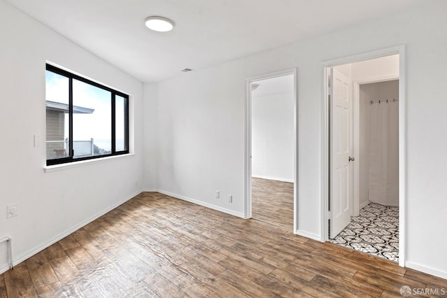 11 Sparta St, San Francisco, CA 94134 - unfurnished room featuring wood finished floors and baseboards