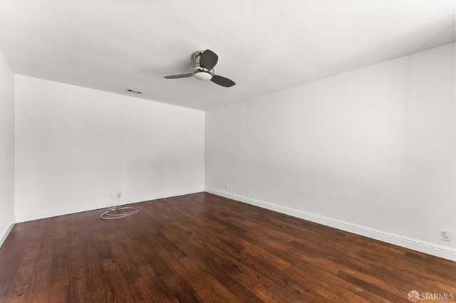 unfurnished room featuring ceiling fan and dark hardwood / wood-style floors