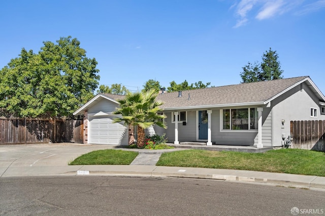 ranch-style home featuring a garage and a front lawn