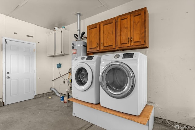 laundry area with cabinets, secured water heater, and washing machine and clothes dryer