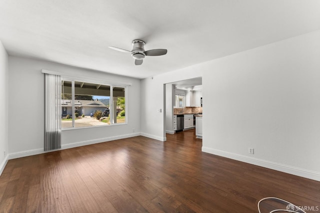 unfurnished room with dark hardwood / wood-style floors and ceiling fan