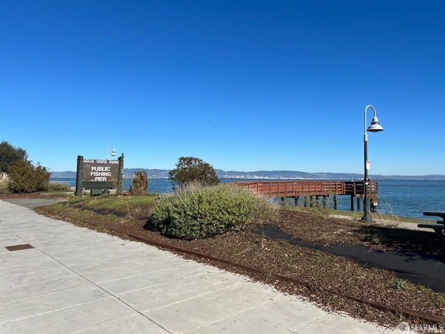 view of home's community with a water and mountain view