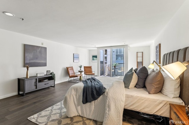 bedroom with access to outside, baseboards, and dark wood-style floors