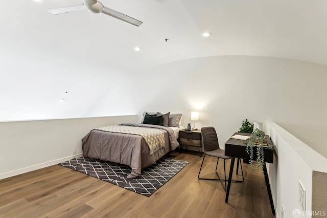 bedroom with a ceiling fan, recessed lighting, wood finished floors, and lofted ceiling