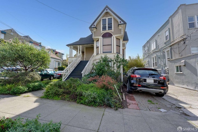 view of front facade with stairs and a residential view