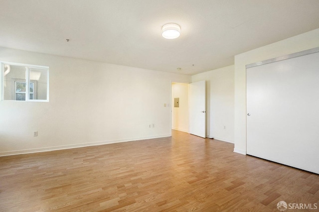 unfurnished room with light hardwood / wood-style flooring