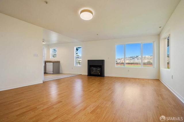 unfurnished living room with light hardwood / wood-style flooring