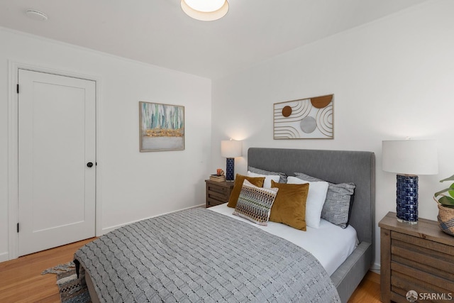 bedroom with light wood finished floors