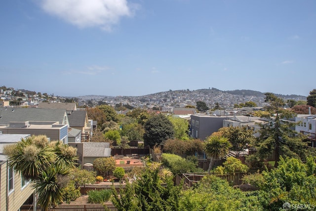 view of mountain background with nearby suburban area