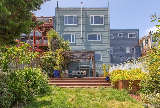 back of property featuring a deck