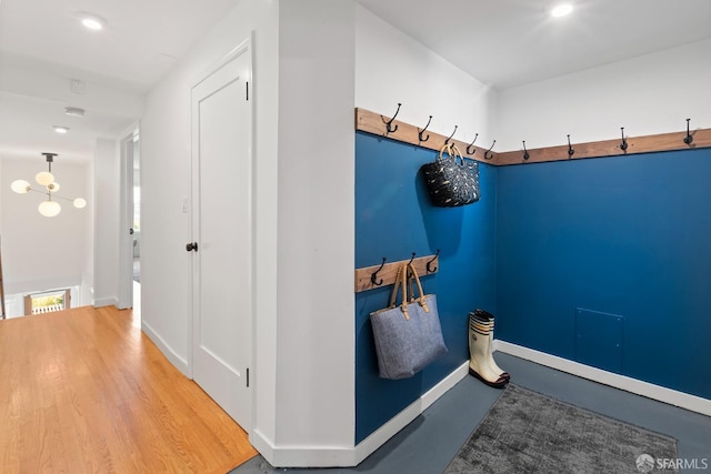 mudroom with baseboards and wood finished floors