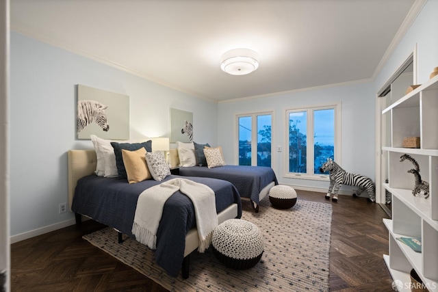 bedroom with ornamental molding and baseboards