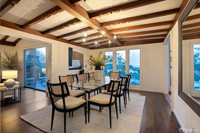 dining space with baseboards, beamed ceiling, wood finished floors, and an inviting chandelier