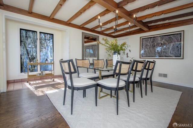 dining area with visible vents, beamed ceiling, baseboards, and wood finished floors