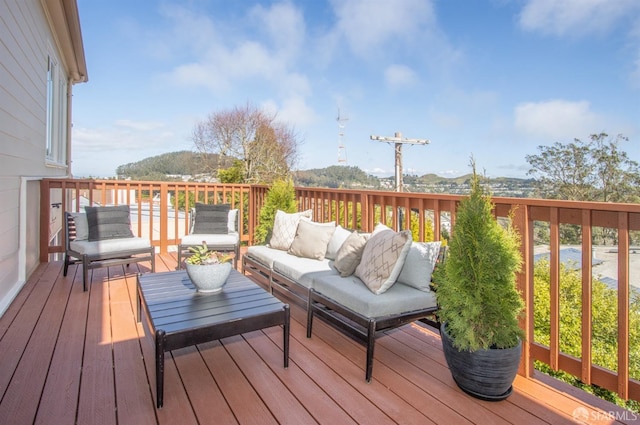 wooden deck featuring an outdoor living space