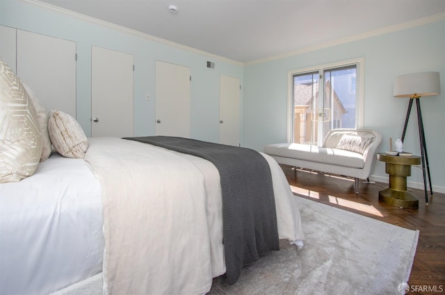 bedroom featuring visible vents and crown molding