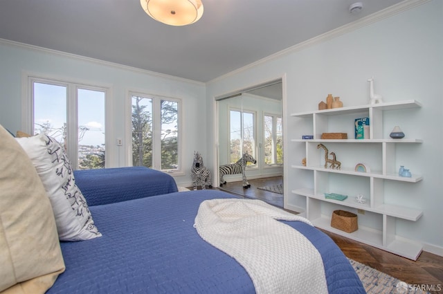 bedroom featuring baseboards, a closet, access to exterior, and crown molding