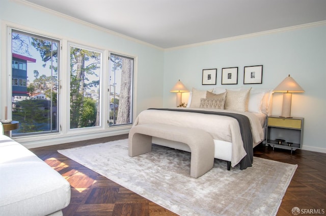 bedroom with ornamental molding and baseboards