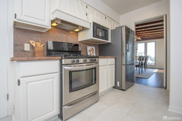 kitchen featuring stainless steel appliances, white cabinets, and custom range hood