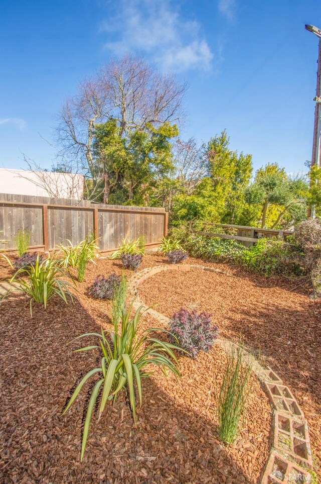 view of yard featuring fence