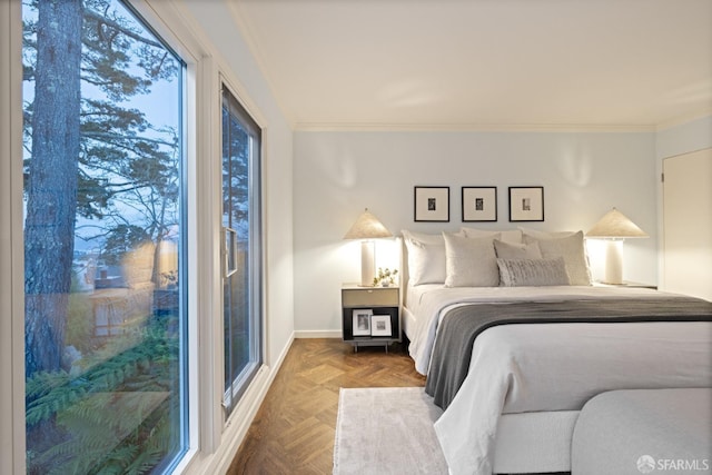 bedroom featuring baseboards and crown molding