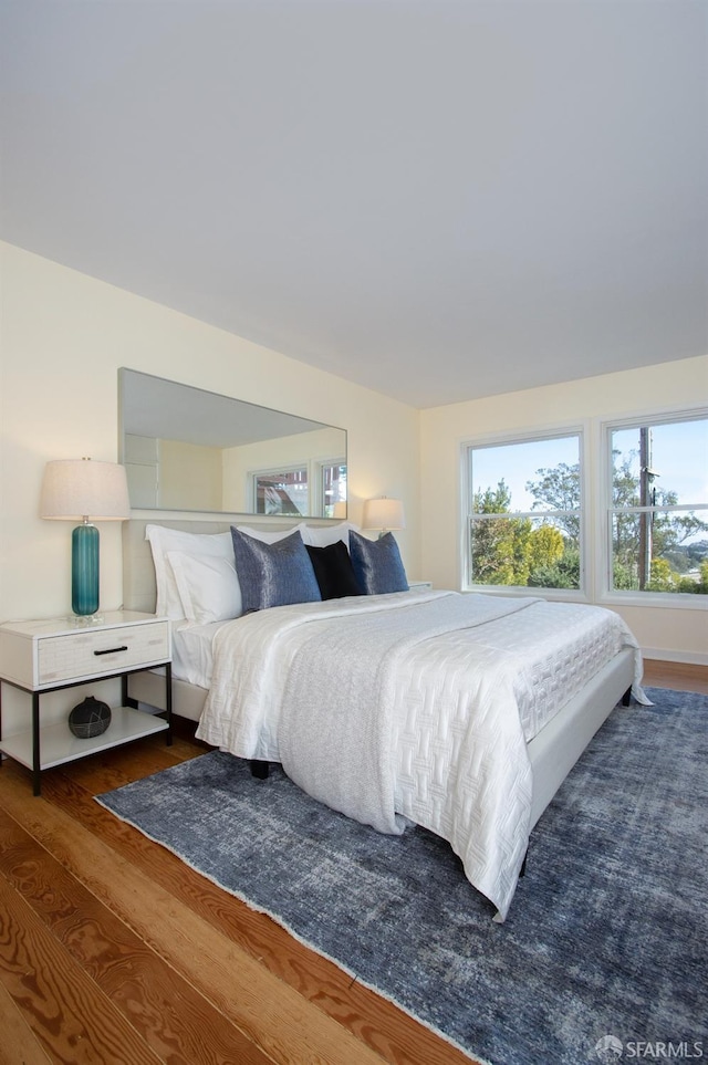 bedroom with wood finished floors