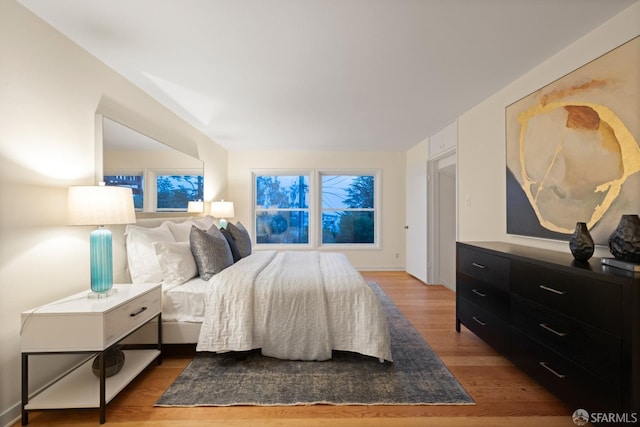 bedroom with wood finished floors