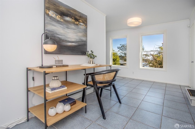 office area with ornamental molding and baseboards