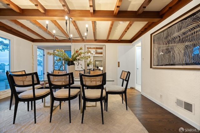 dining area with a notable chandelier, wood finished floors, visible vents, baseboards, and beamed ceiling