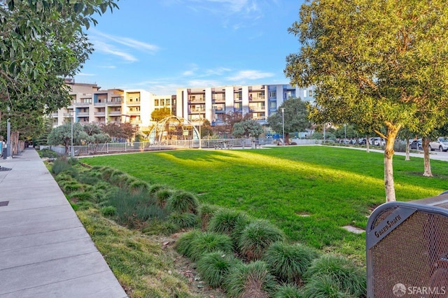 view of property's community featuring a lawn