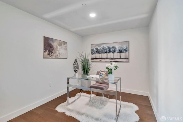 office with dark wood-type flooring