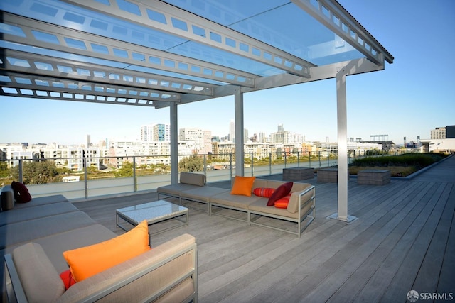 wooden terrace with an outdoor living space and a pergola