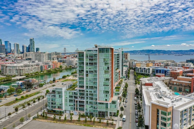 property's view of city featuring a water and mountain view