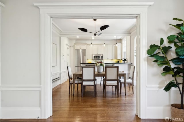 1856 Franklin St Unit 4, San Francisco, CA 94109 - dining area featuring dark wood-style floors, crown molding, a decorative wall, and a ceiling fan