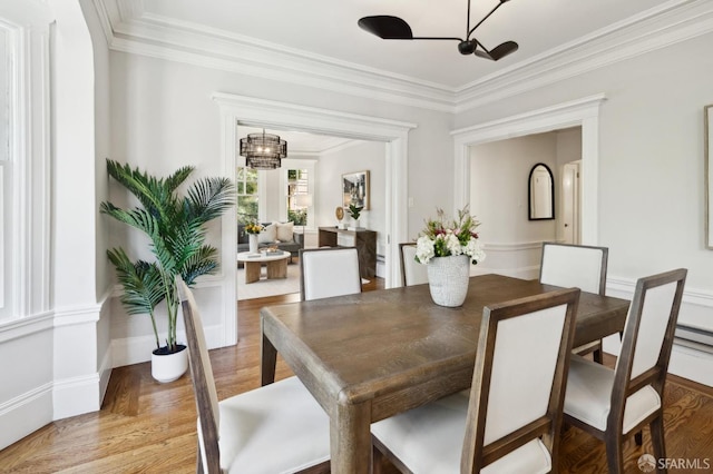 1856 Franklin St Unit 4, San Francisco, CA 94109 - dining area featuring a chandelier, light wood-style flooring, and crown molding