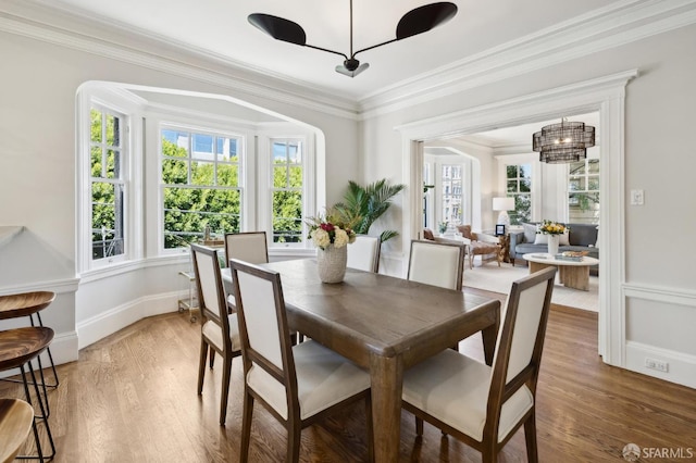1856 Franklin St Unit 4, San Francisco, CA 94109 - dining area featuring light wood-style flooring, a chandelier, and crown molding
