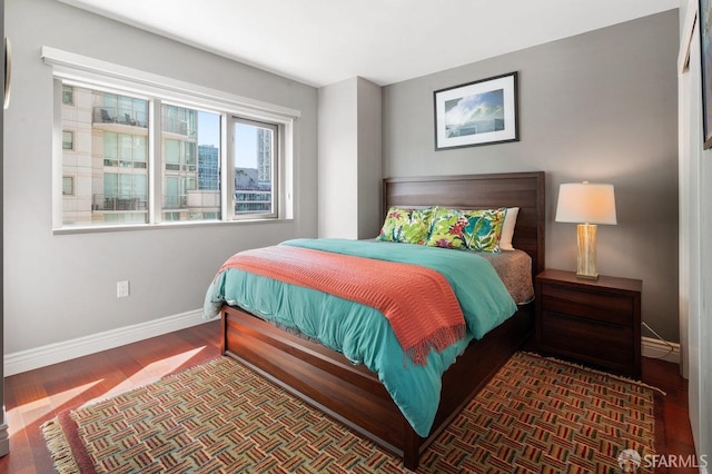 bedroom featuring dark hardwood / wood-style floors