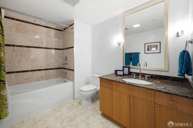 full bathroom featuring shower / bath combination with curtain, vanity, and toilet