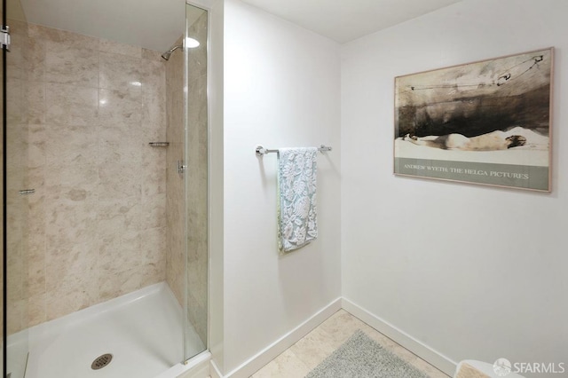 bathroom featuring a tile shower and tile patterned floors