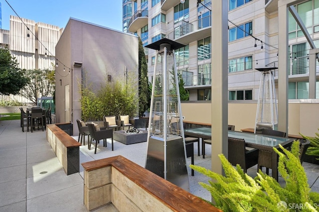 exterior space featuring a patio area and an outdoor fire pit