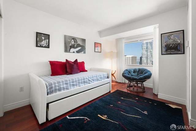 bedroom featuring dark wood-type flooring