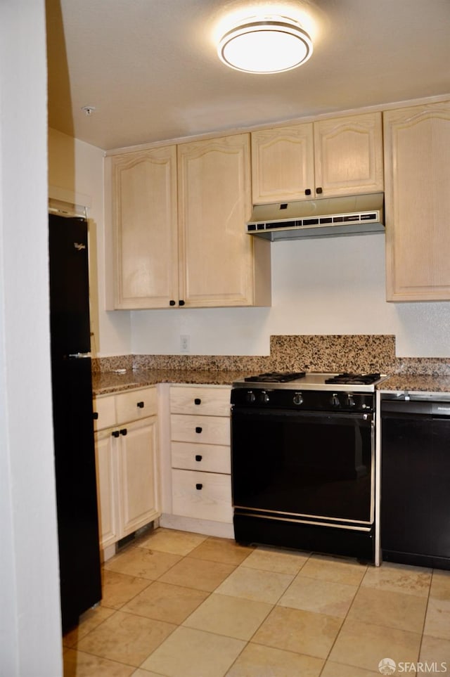kitchen with light tile patterned flooring, under cabinet range hood, black appliances, and light brown cabinets