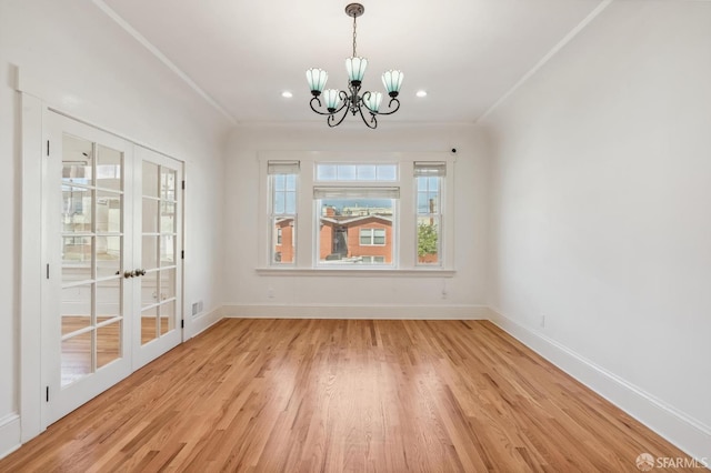 unfurnished dining area featuring a chandelier, recessed lighting, baseboards, light wood-style floors, and crown molding