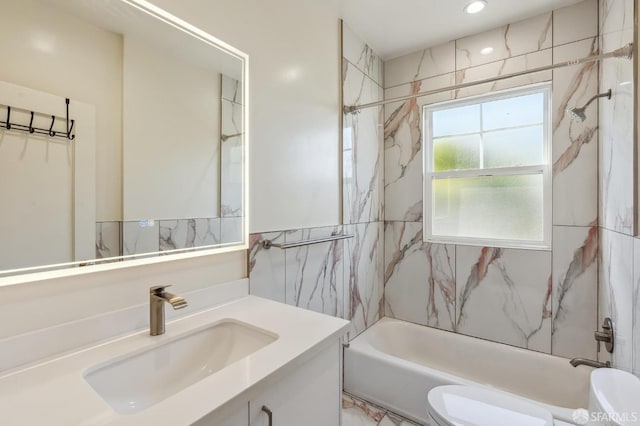 full bathroom with shower / washtub combination, tile walls, recessed lighting, toilet, and vanity