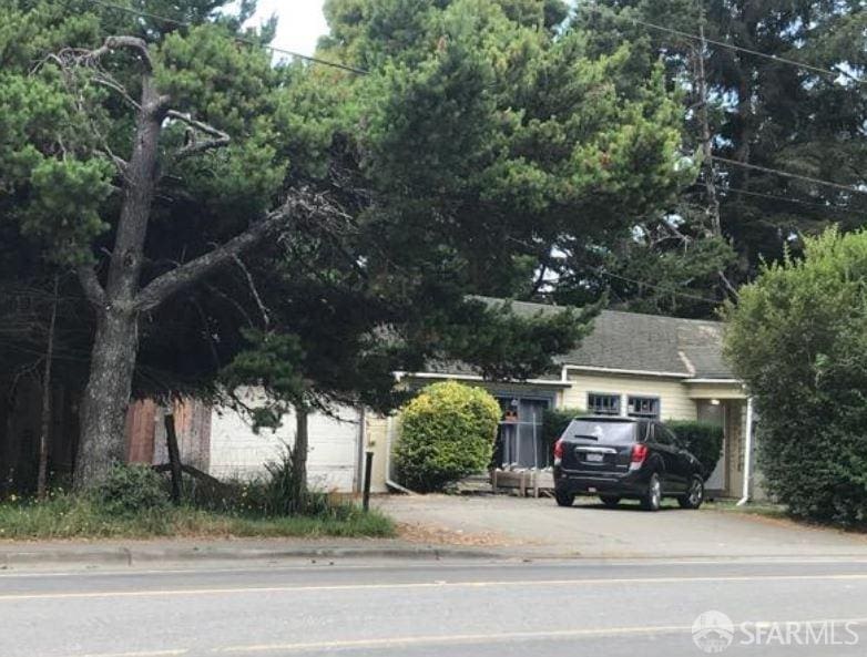 obstructed view of property featuring a garage