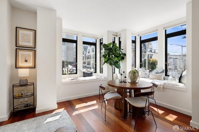 dining space with hardwood / wood-style flooring and plenty of natural light