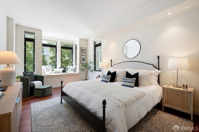 bedroom featuring dark wood-type flooring