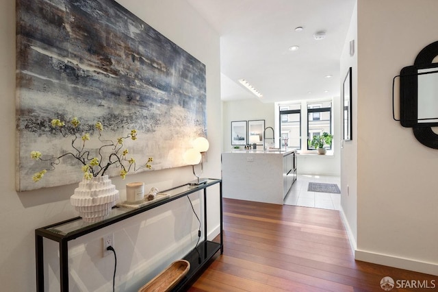 hallway featuring hardwood / wood-style flooring